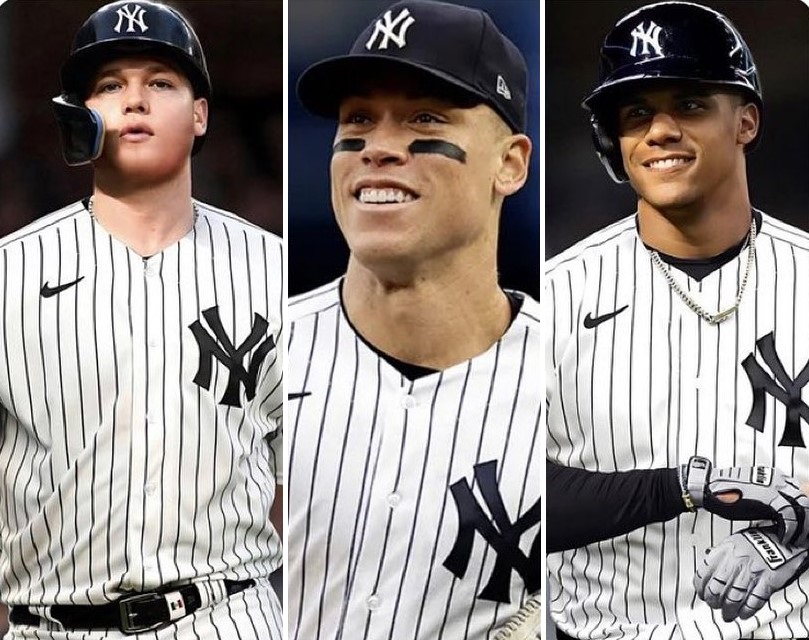 New York Yankees captain Aaron Judge is flanked by new signings Alex Verdugo and Juan Soto