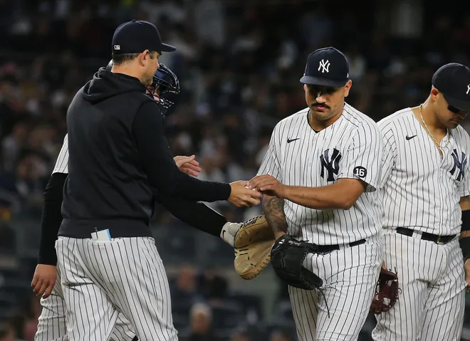 Aaron Boone with Nestor Cortes