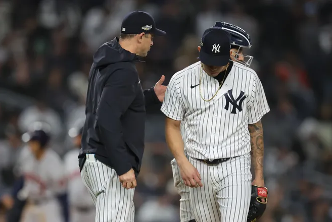 Jonathan Loaisiga looks dejected Yankees player after losing game to the Astros.