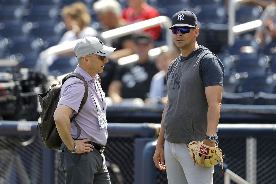 Yankees GM Cashman and manager Boone to make decisions on free agents, potential trades.