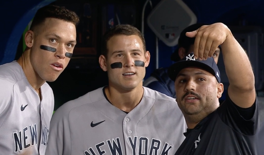 Nestor Cortes, Aaron, Judge, and Anthony Rizzo during a Yankees game.