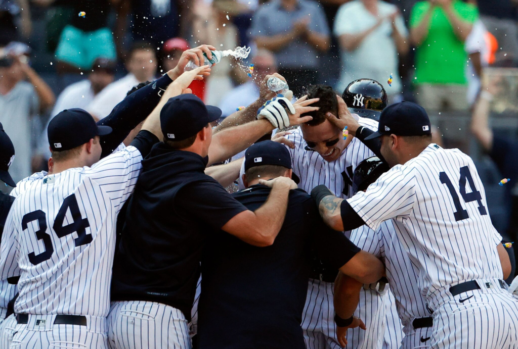 Yankees players are celebrating with Aaron Judge