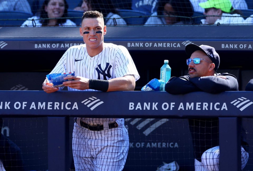Aaron Judge with Nestor Cortes in the Yankees dugout.