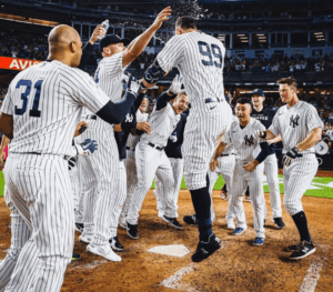 The New York Yankees team is celebrating after a win.