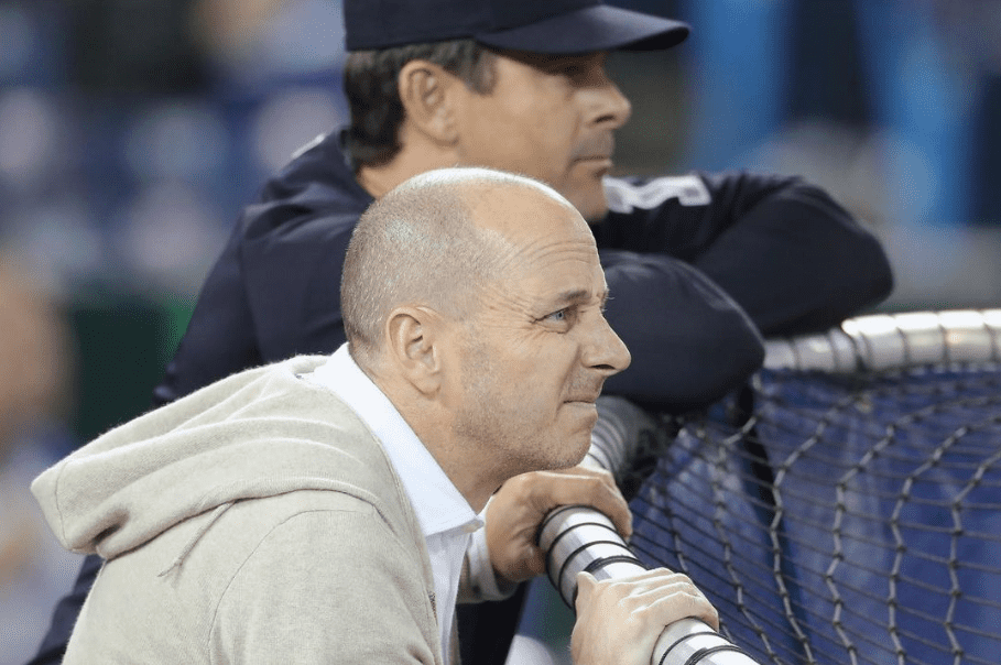 Yankees general manager Brian Cashman is seen with manager Aaron Boone at a training session and the duo is to finalize the Yankees shortstop choice.