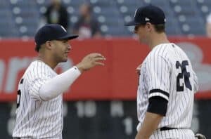 DJ LeMahieu and Gleyber Torres are shaking hands after a Yankees game at Yankee Stadium, New York.