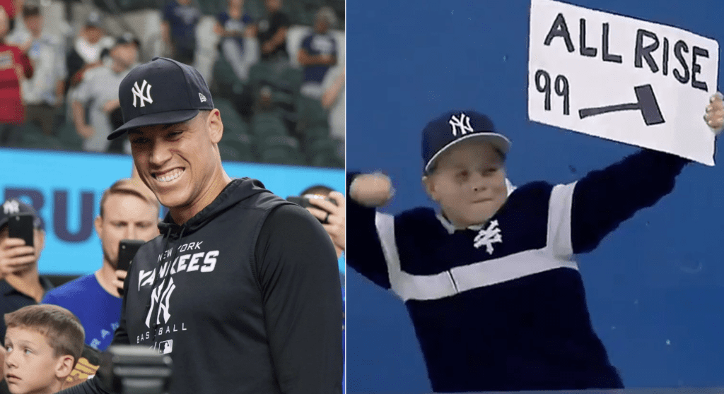 Aaron Judge and a young fan holding All-Rise placard during a training session.