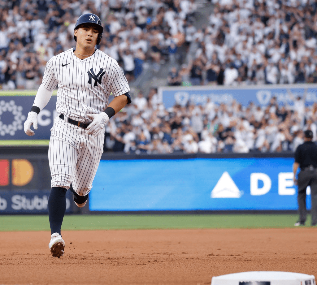 Anthony Volpe is running to reach a base against the Twins on April 15, 2023, at Yankee Stadium.
