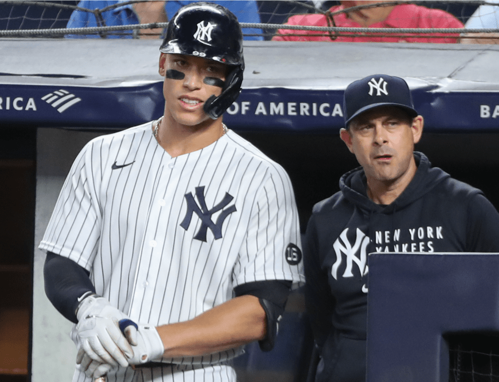 Yankees Aaron Judge and Aaron Boone look on as their offense fail against the Blue Jays at Yankee Stadium on April 23, 2023.