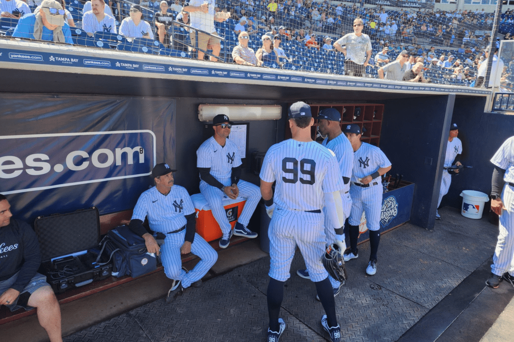 Aaron Judge is at Yankees dugout and fans are looking at him.