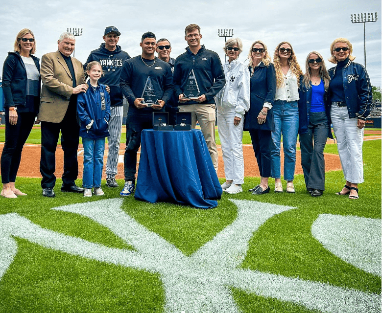 Jasson Dominguez is presented with a memento for his 2023 spring training achievements.