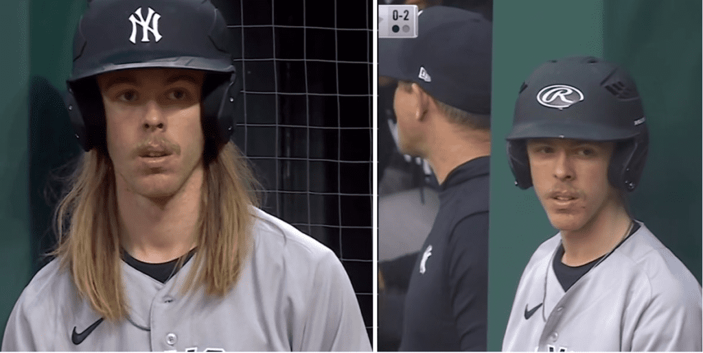 The Cleveland batboy wearing the Yankees uniform with long hair on April 10, 2023, and again appears in the next game on April 11 with his long hair tucked.
