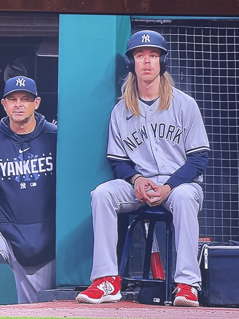 Yankees bat boy hides long hair after uproar over breaking team