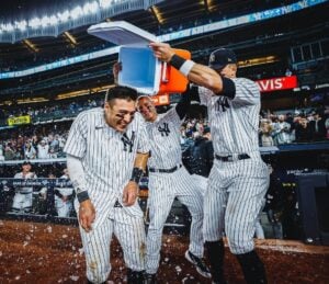 Yankees' Aaron Judge and Anthony Rizzo pour ice on Anthony Volpe, who hit the winning run against Baltimore at Yankee Stadium on May 24, 2023.