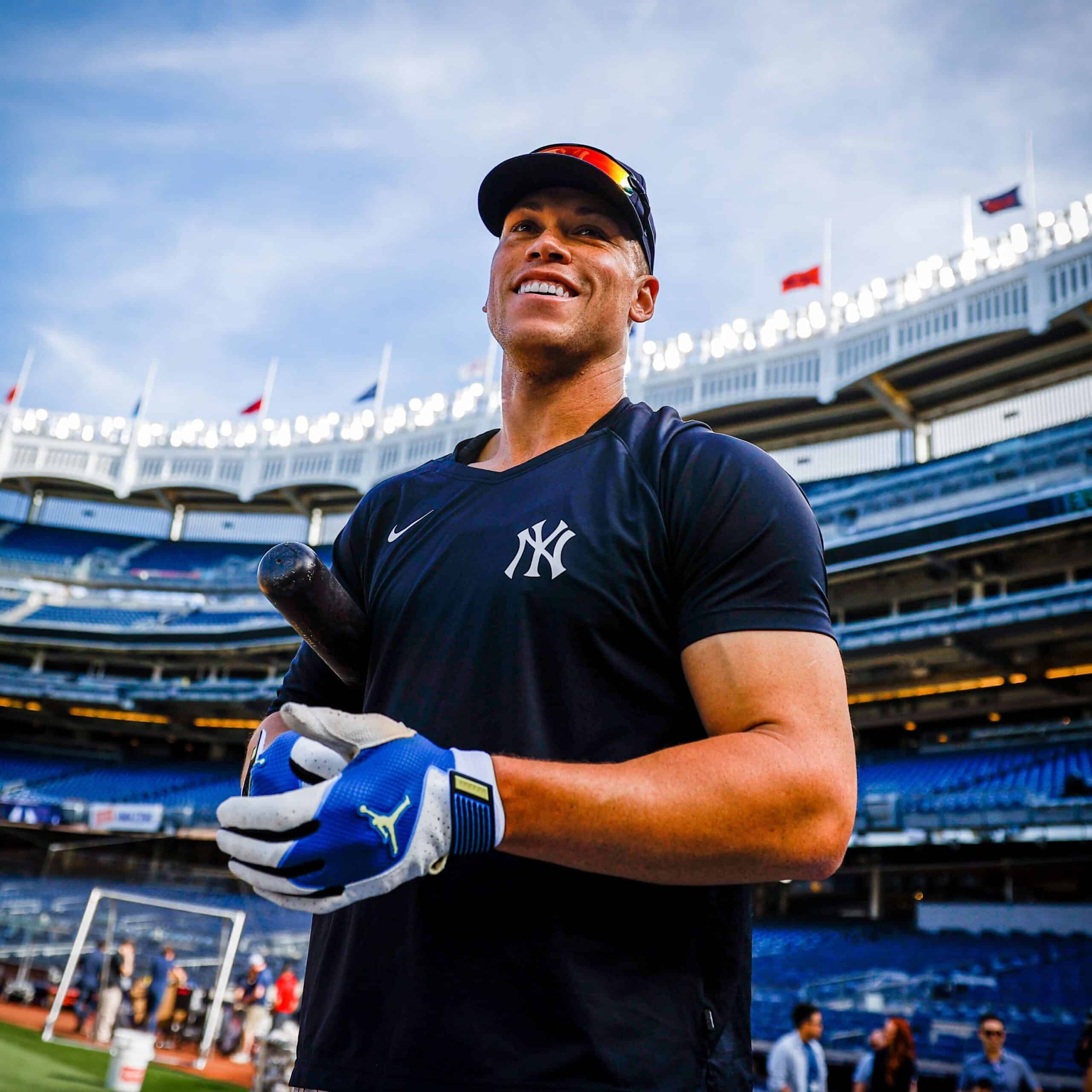 New York Yankees' Aaron Judge smiles after a home run by Yankees