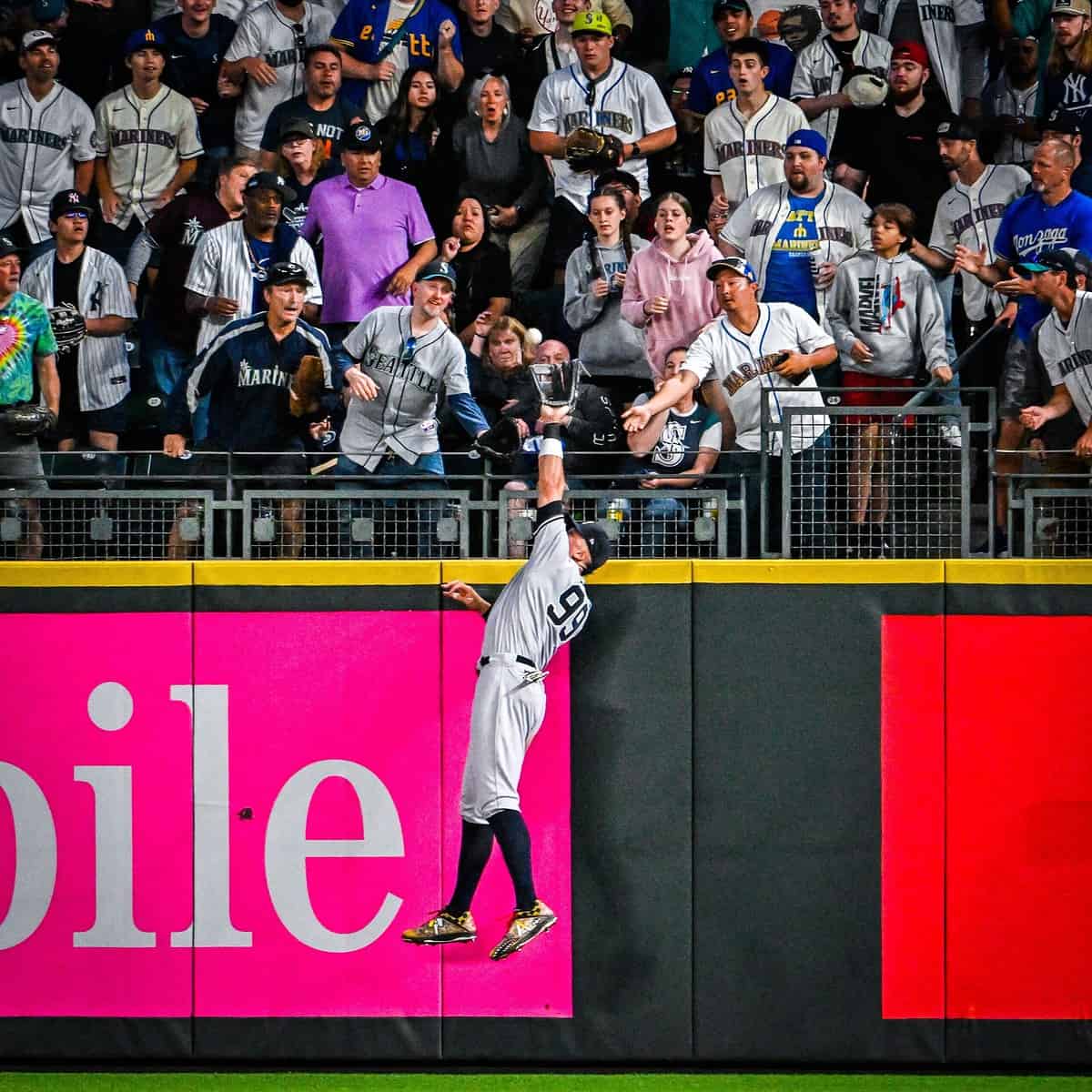 Aaron Judge of the Yankees is taking a spectacular catch prevented Teoscar Hernandez of Seattle from hitting a home run on May 29, 2023.