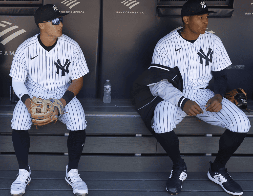 Rookies Anthony Volpe and Jhony Brito of the New York Yankees at dugout, Yankee Stadium.