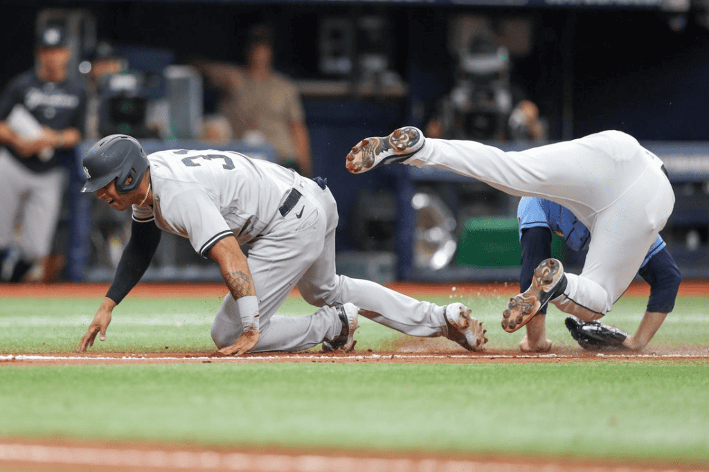 The Rays' reliever Garrett Cleavinger runs into the New York Yankees’ Aaron Hicks on May 7, 2023, at Tropicana Field.