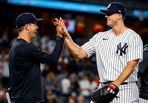 Yankees pitcher Clay Holmes with pitching coach Matt Blake.