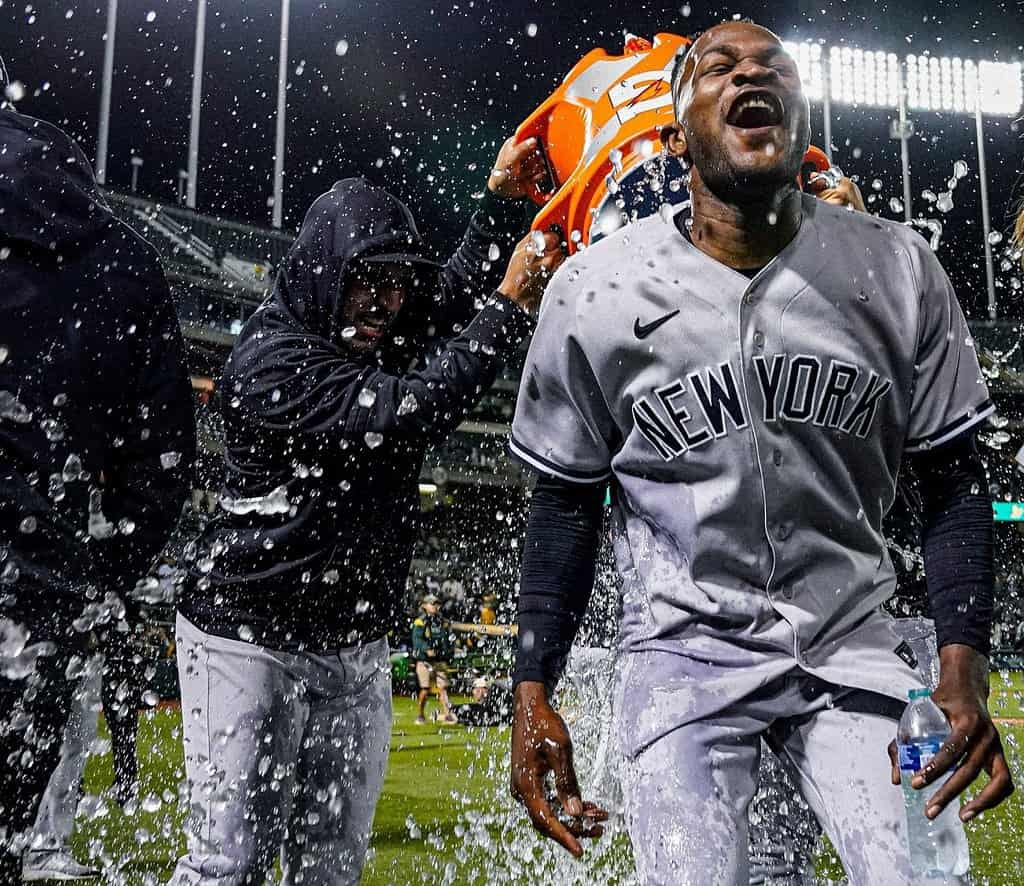 Nestor Cortes pours a bucket of water on Yankees pitcher Domingo German to celebrate his perfect game against Oakland  on June 29, 2023.