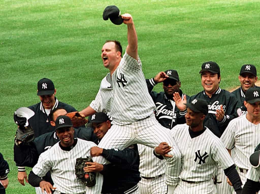 David Wells got a hero's escort from his teammates after retiring all 27 Twins on May 17, 1998.