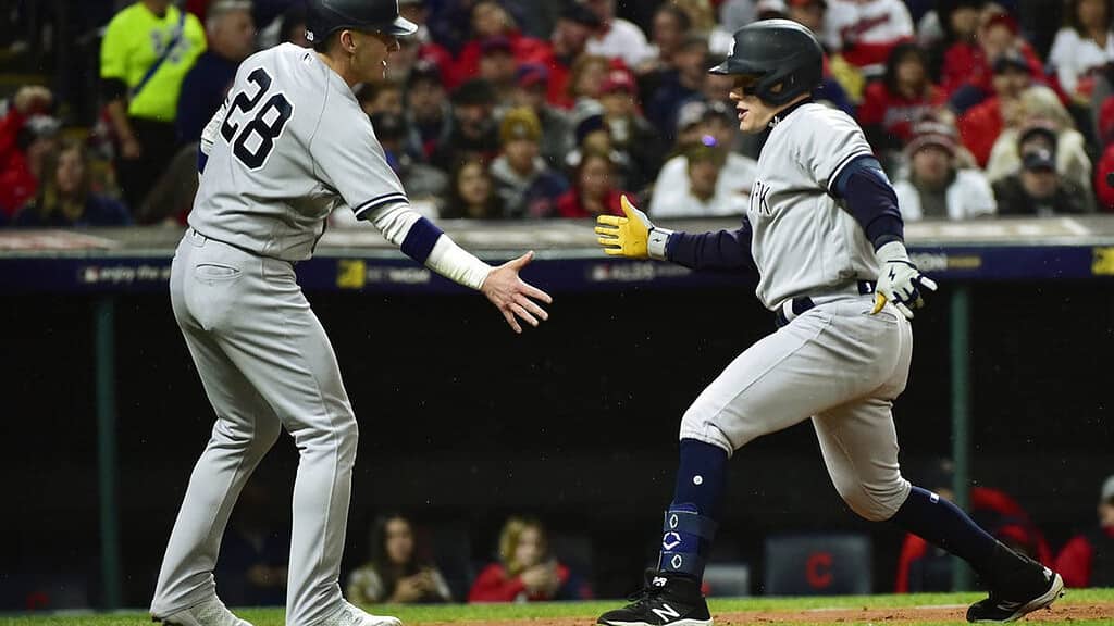 Center fielder Harrison Bader celebrating with his collegue during a Yankees' game,
