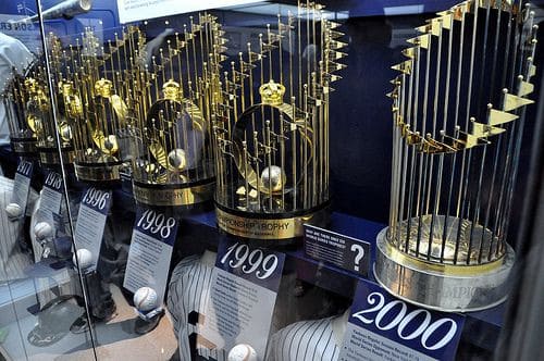World Series trophies won by the New York Yankees in 1977, 1978, 1998, 1999, and 2000 are on display.