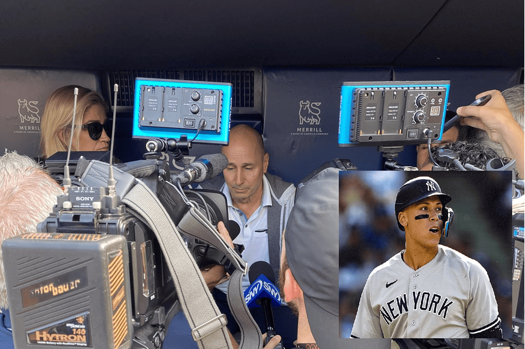 Yankees GM Brian Cashman is talking to the media about Aaron Judge on June 20, 2023, at Yankee Stadium. Inset Aaron Judge