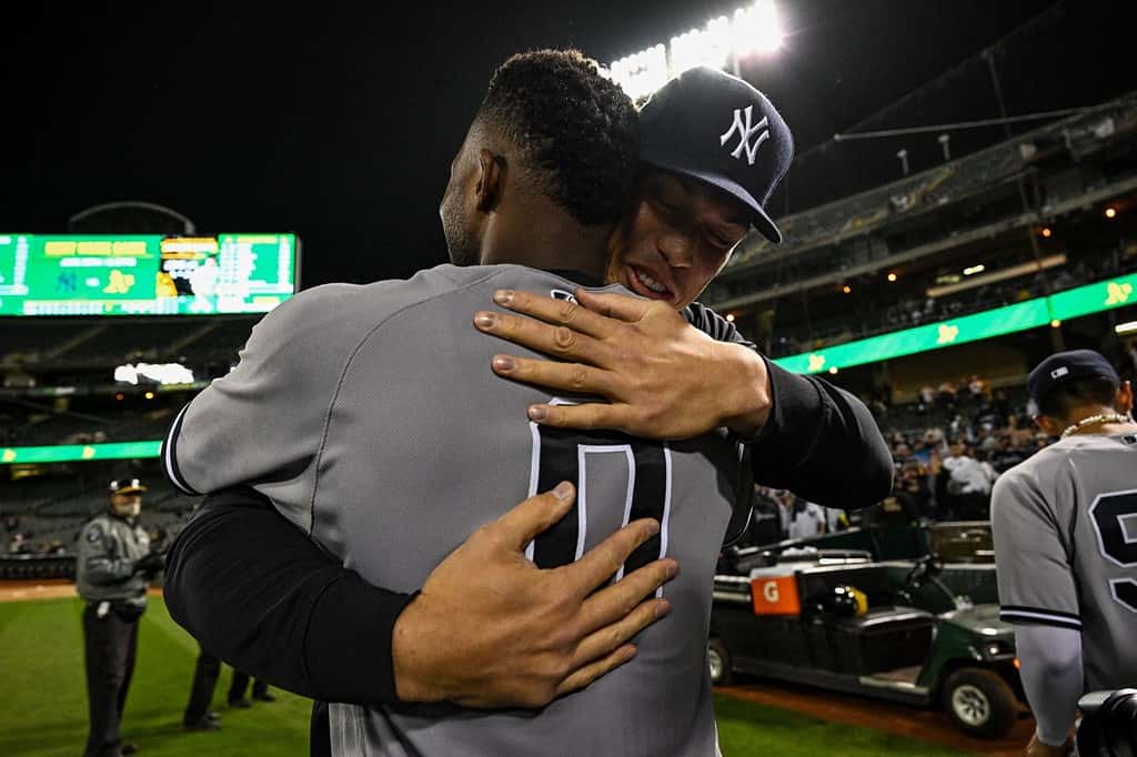 Aaron Judge hugs Domingo German after he pitched a perfect game against the A's on June 28, 2023, at Oakland.