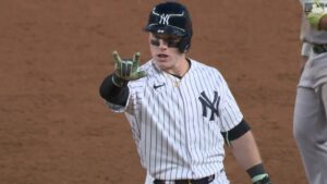 Harrison Bader gives wine to Yankees teammates after big moment.