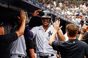 Giancarlo Stanton celebrates with Yankees teammates after hitting two homers vs. the Cubs on July 8, 2023, at Yankee Stadium.