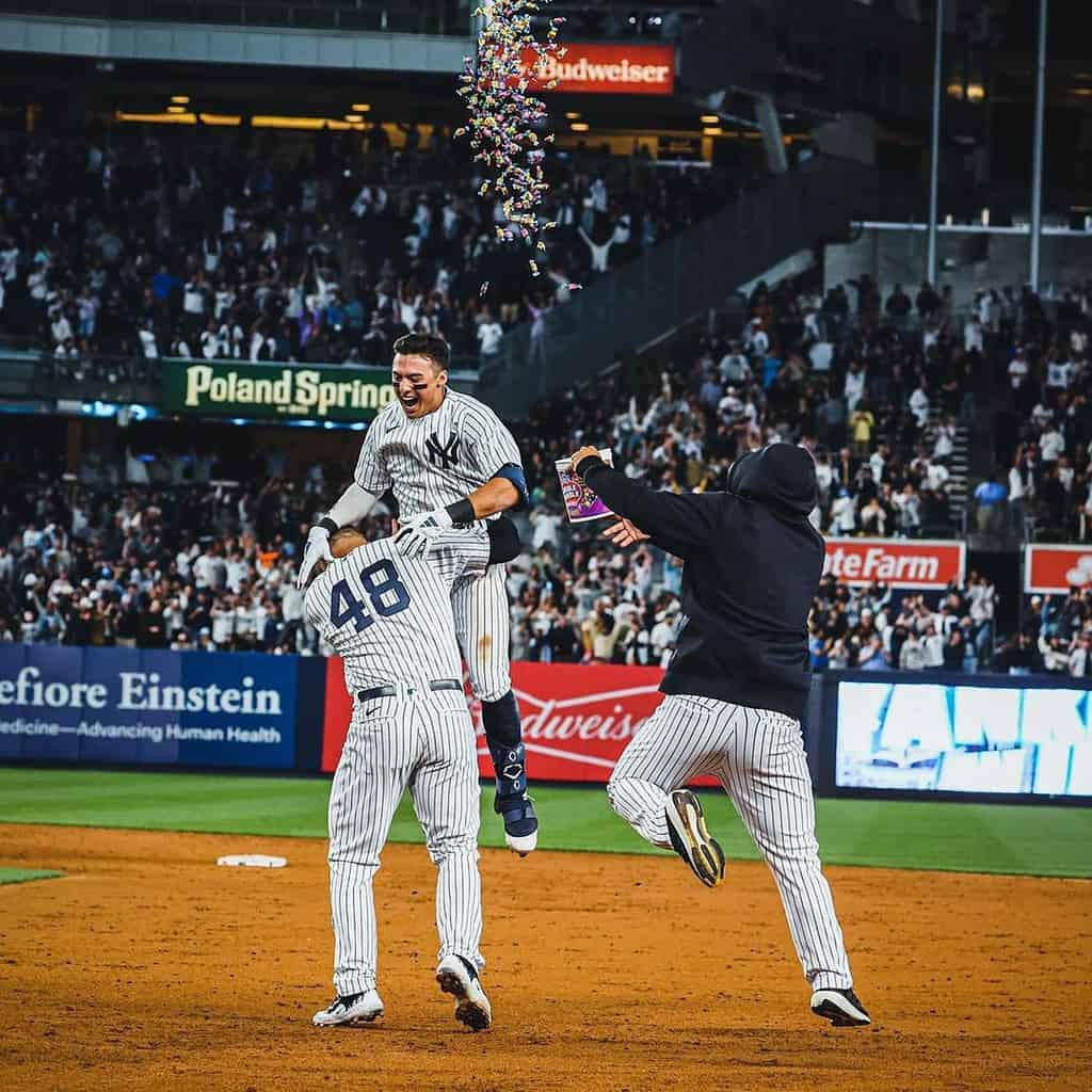 Anthony Volpe is celebrating with Rizzo and Cortes after the Yankees beat the Orioles on May 23, 2023, at Yankee Stadium.