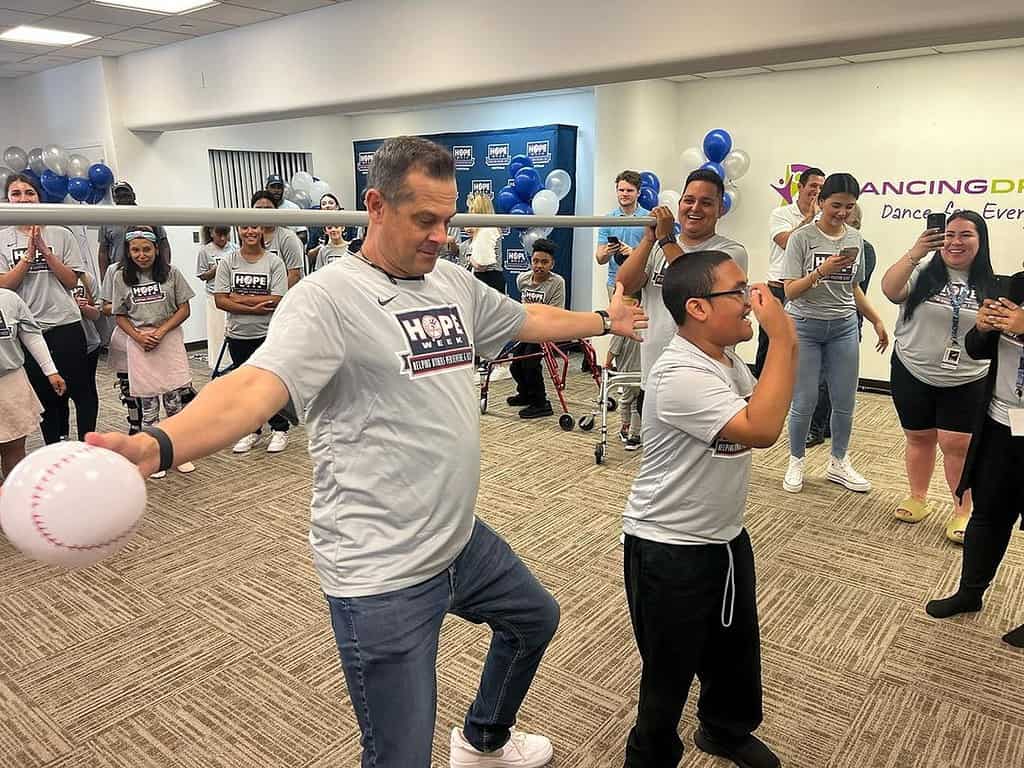 As part of the Yankees' 2023 Hope Week, Aaron Boone dances at Dancing Dreams with children having medical and physical challenges.
