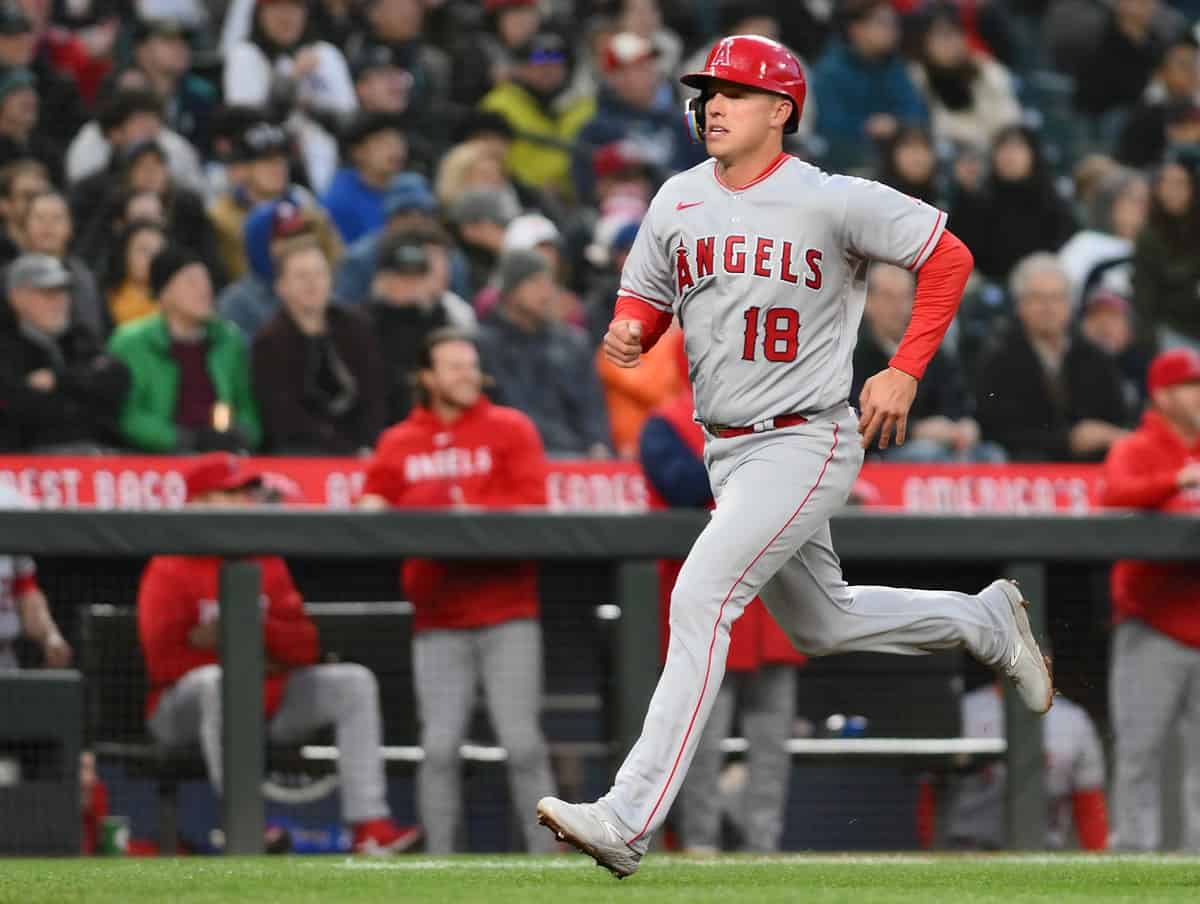 Apr 3, 2023; Seattle, Washington, USA; Los Angeles Angels first baseman Jake Lamb (18) scores a run off an RBI single hit by shortstop Luis Rengifo (2) (not pictured) during the fourth inning at T-Mobile Park.