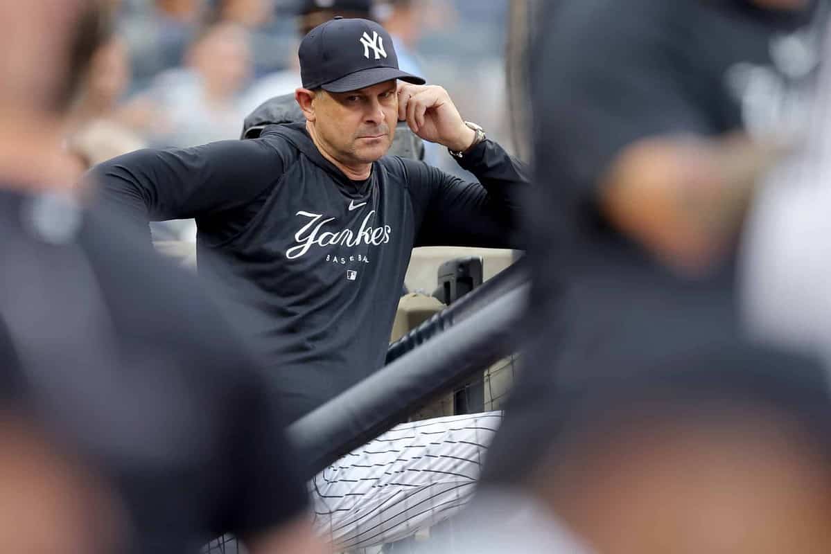 Jul 7, 2023; Bronx, New York, USA; New York Yankees manager Aaron Boone (17) in the dugout before the start of a game against the Chicago Cubs at Yankee Stadium.