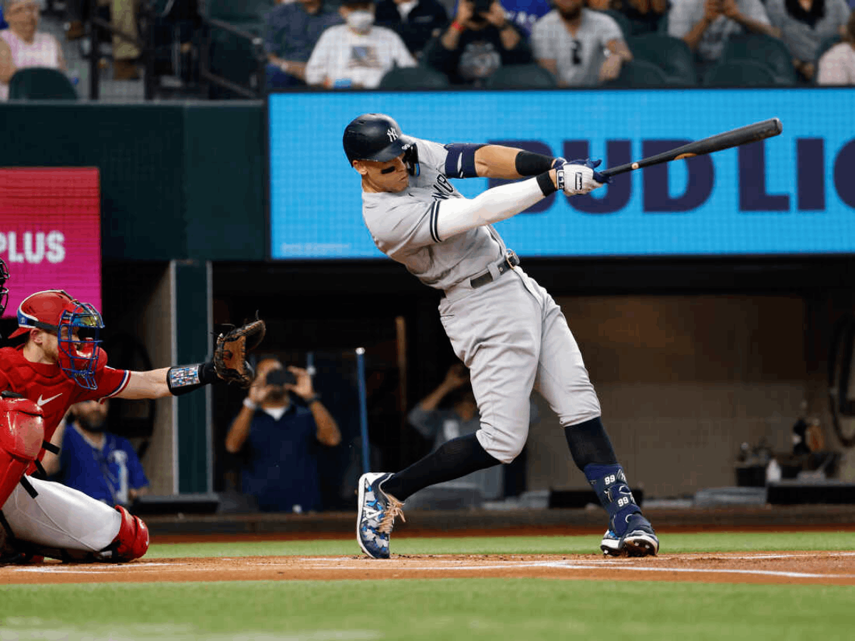 Yankees' star Aaron Judge scoring a home run.