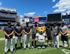 Yankees manager Aaron Boone with his staff at Yankee Stadium