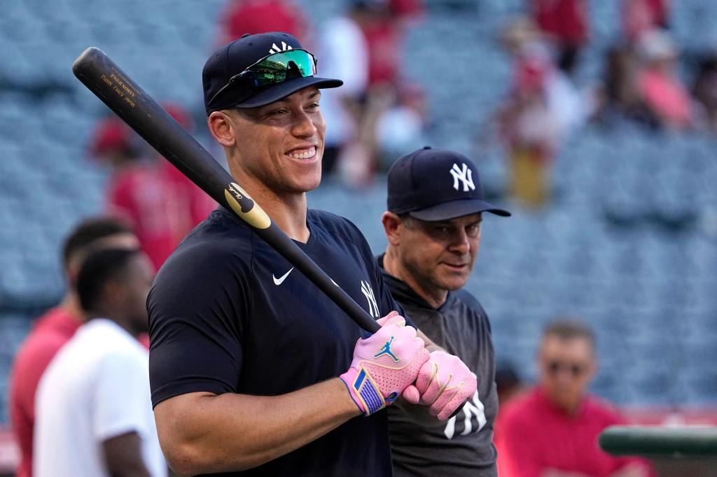  Aaron Judge smiles during batting practice as Yankee manager Aaron Boone stands by prior to a game against the Los Angeles Angels Tuesday, July 18, 2023.