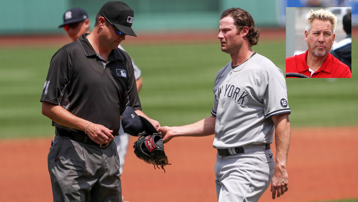 Brian Harkins inset and Yankees righthander Gerrit Cole gets checked for sticky stuff at Fenway Park in 2021.