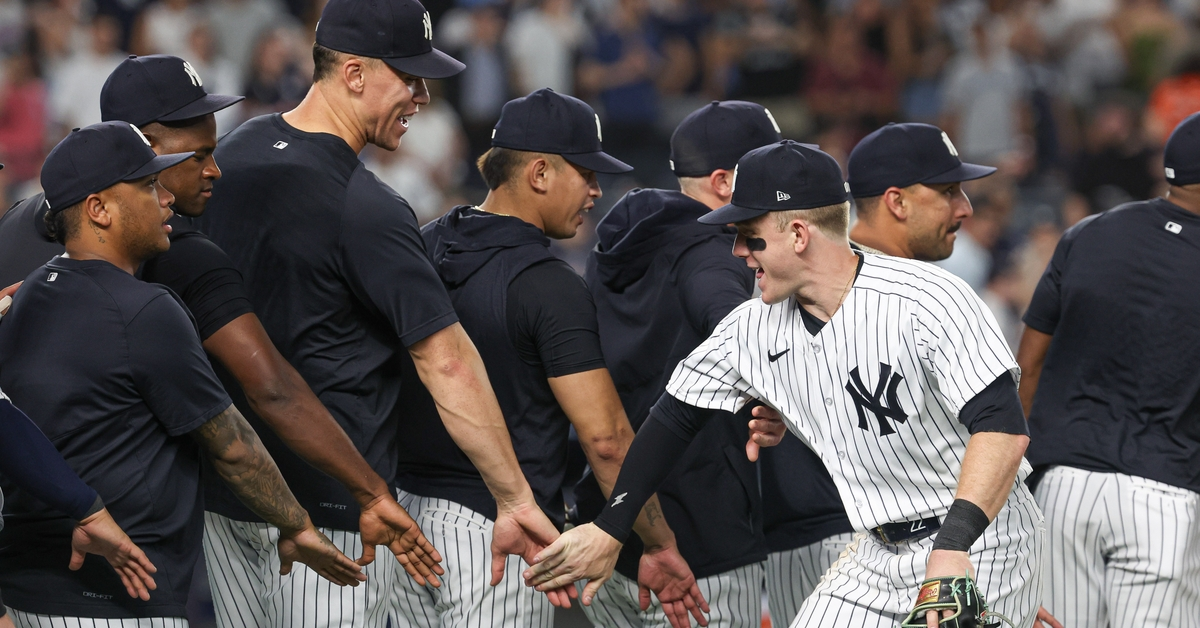 The New York Yankees team in a celebratory mode after their win against the Royals in Yankee Stadium on July 25, 2023.