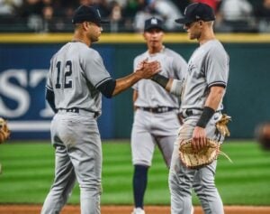 Yankees pitcher Jonathan celebrates victory over the White Sox with catcher Kyle Higashioka on August 8, 2023, in Chicago.