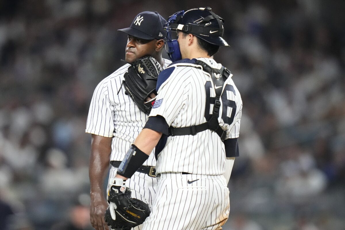 New York Yankees catcher Kyle Higashioka, right, talks to starting pitcher Luis Severino after Houston Astros' Yordan Alvarez hit a home run during the fifth inning of a baseball game Friday, Aug. 4, 2023, in New York