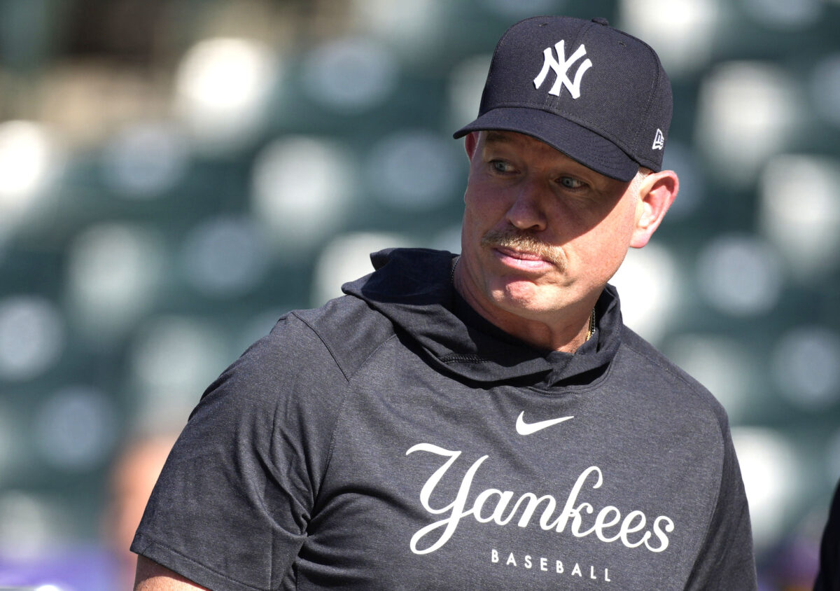 New York Yankees hitting coach Sean Casey watches players warm up for a baseball game against the Colorado Rockies on Friday, July 14, 2023, in Denver.