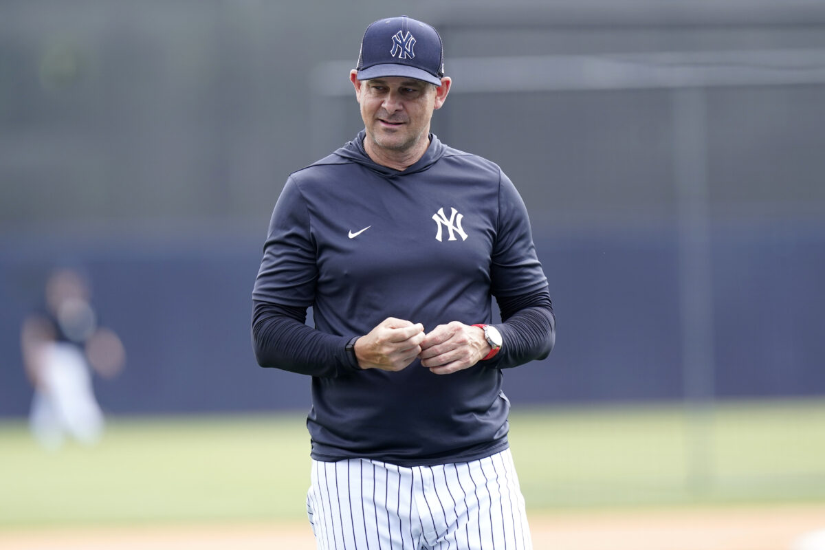 New York Yankees manager Aaron Boone watches batting practice before a spring training baseball game against the Atlanta Braves, Saturday, April 2, 2022, in Tampa, Fla.