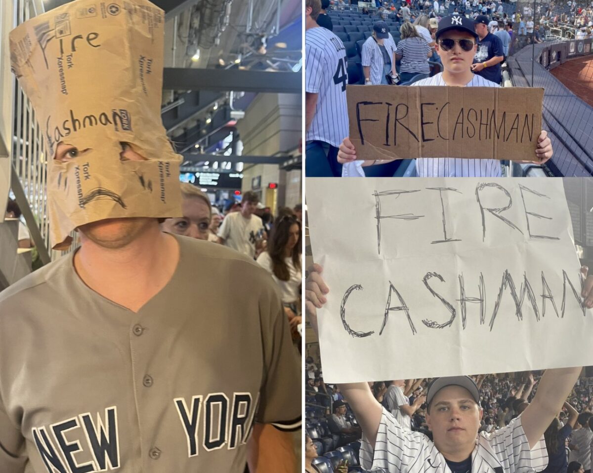 Los aficionados de los Yankees protestan con carteles de FIRE CASHMAN durante la temporada 2023.