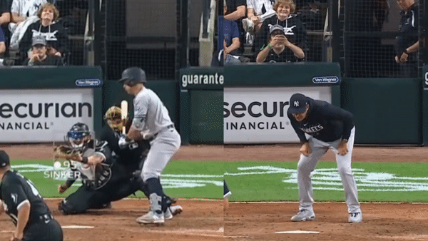 Aaron Boone is mimicking umpire Laz Diaz's actions before his ejection during the game against the White Sox on Aug 7, 2023, at Guaranteed Rate Field.