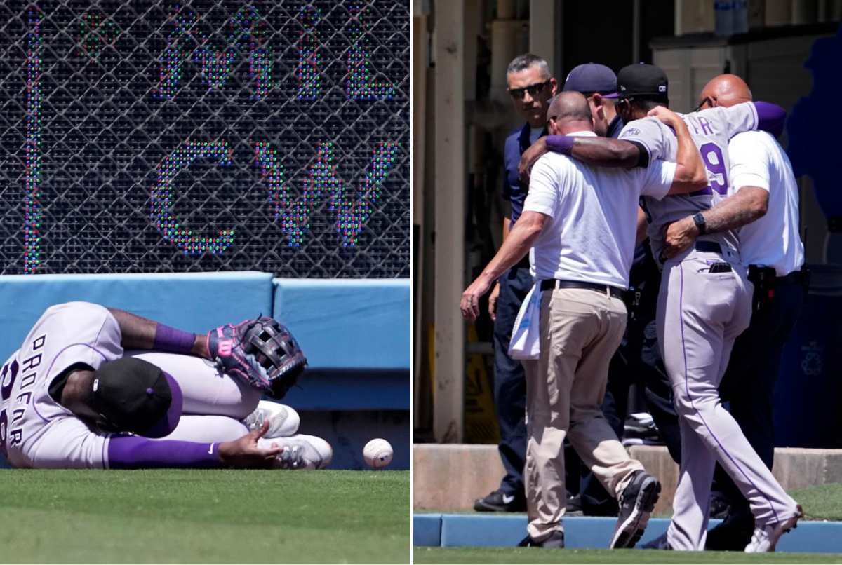 Jurickson Profar of the Colorado Rockies got injured after hitting outfield wall at Dodger Stadium on August 13, 2023.