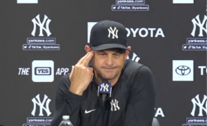 Aaron Boone, the manager of the New York Yankees, is making a gesture during the post-game press meet on Aug 19, 2020, at Yankee Stadium.