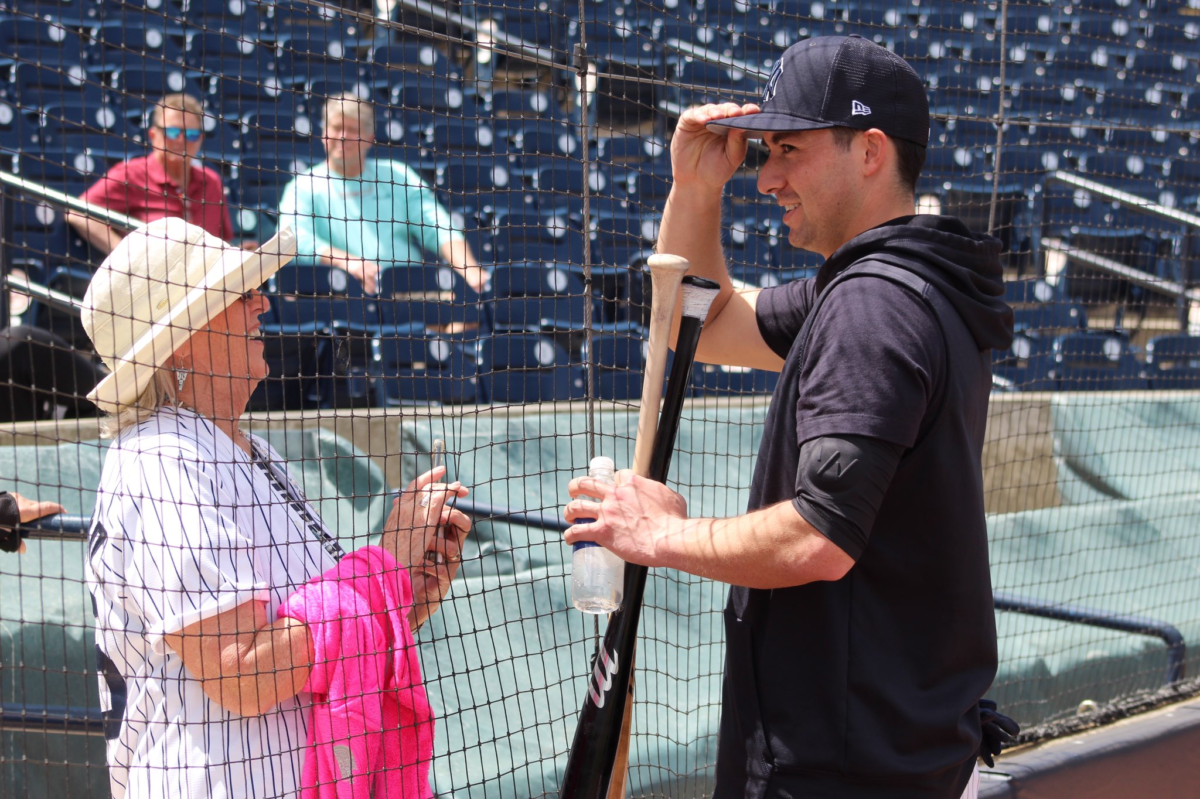 Kyle Higashioka of the New York Yankees is seen with his mom.