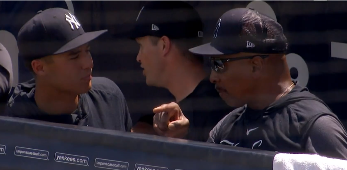 Yankees legend Willie Randolph is seen with Anthony Volpe in the Yankees dugout.